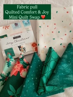 Fabric pull for the Quilted Comfort & Joy Mini Quilt Swap featuring green and cream Christmas quilting fabrics with holly and festive prints.