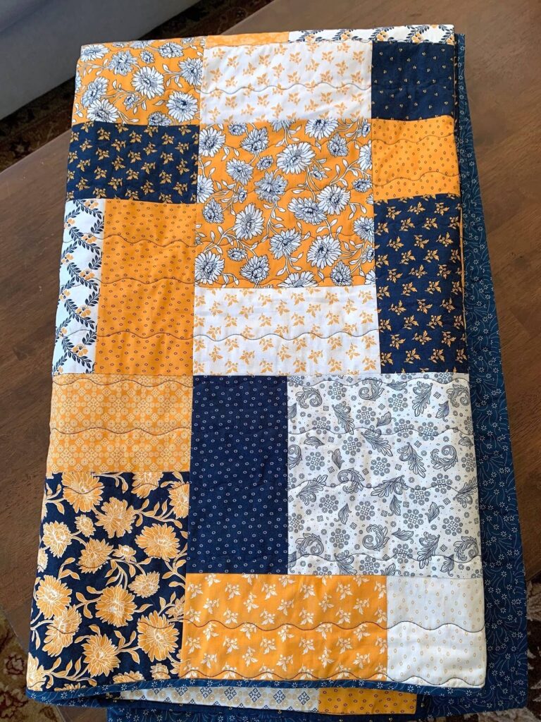 Layer Cake Loop quilt photographed flat